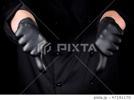 chef in black latex gloves shows gesture not like chef in black latex gloves shows gesture not like 47191170