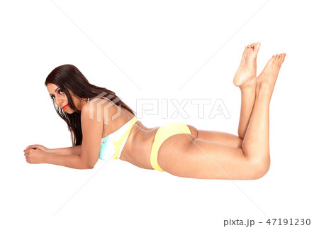 Gorgeous woman lying in bikini on floor Gorgeous woman lying in bikini on floor 47191230