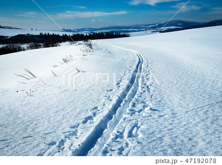 snowy winter landscape with cross country ski path snowy winter landscape with cross country ski path 47192078