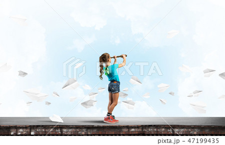 Concept of careless happy childhood with girl exploring this world 47199435