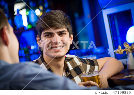 portrait of a young man at the bar portrait of a young man at the bar 47199859