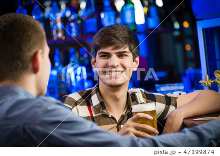 portrait of a young man at the bar 47199874