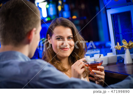 young woman in a bar young woman in a bar 47199890