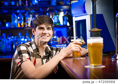 portrait of a young man at the bar portrait of a young man at the bar 47200068