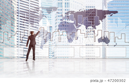 Rear view of businessman drawing social connection and networking concept Rear view of businessman drawing social connection and networking concept 47200302