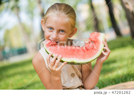 Kid with watermelon slice Kid with watermelon slice 47201262
