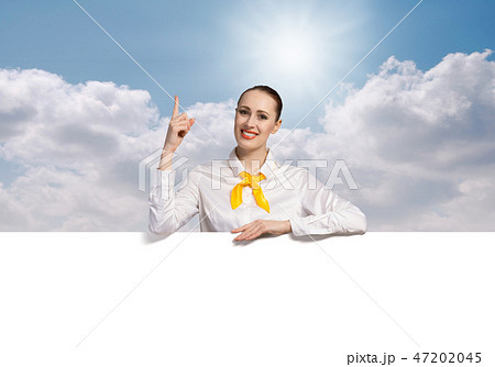 Woman presenting something 47202045