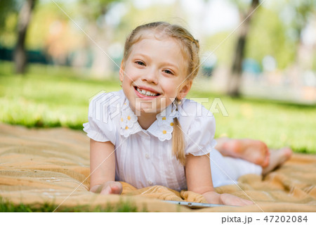 Girl in summer park Girl in summer park 47202084