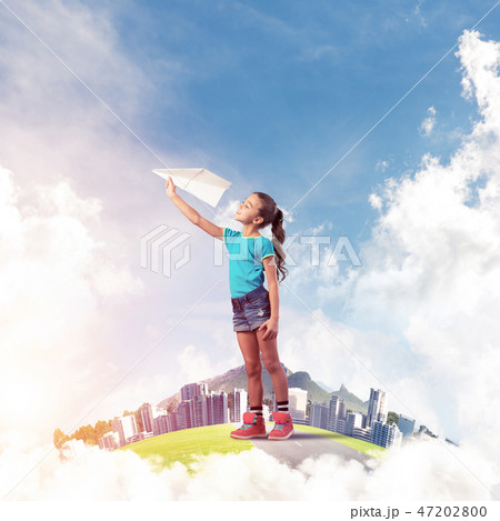 Concept of careless happy childhood with girl dreaming about fut Concept of careless happy childhood with girl dreaming about fut 47202800