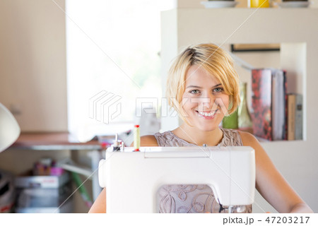 Seamstress at work 47203217