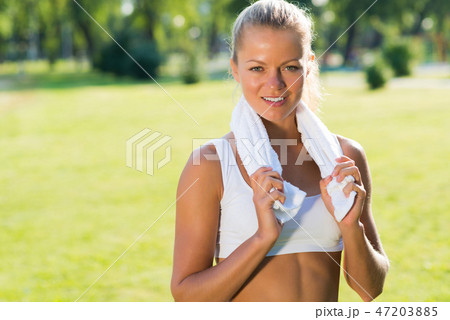 attractive woman with a white towel attractive woman with a white towel 47203885