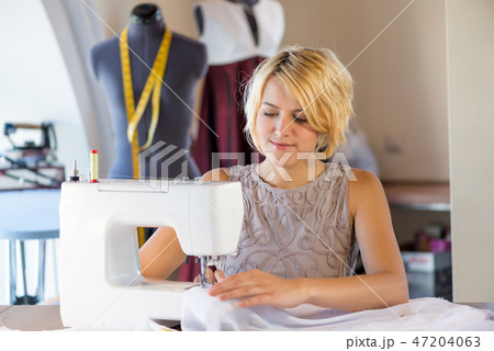 Seamstress at work Seamstress at work 47204063