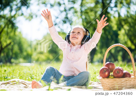 Kid relaxing in park 47204360