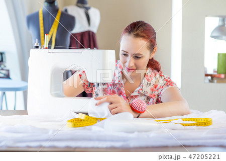 Seamstress at work Seamstress at work 47205221