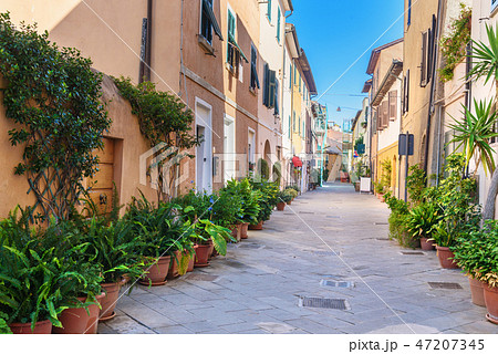 View of narrow street in Orbetello. Tuscany. Italy View of narrow street in Orbetello. Tuscany. Italy 47207345