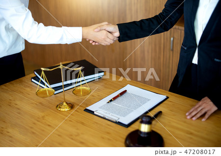 Judge gavel with Justice lawyers having meeting  47208017