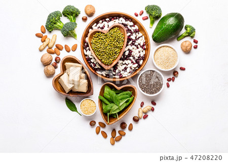 Sources of vegetable protein laid out in the shape of a heart on a white background Sources of vegetable protein laid out in the shape of a heart on a white background 47208220