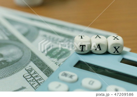 The tax wooden cubic on work table 47209586