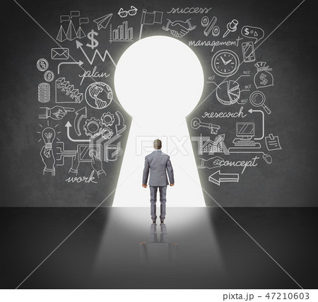Business man standing front key hole door. 47210603
