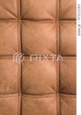 A close-up of a fragment of an expensive brown textile sofa in the room A close-up of a fragment of an expensive brown textile sofa in the room 47211261