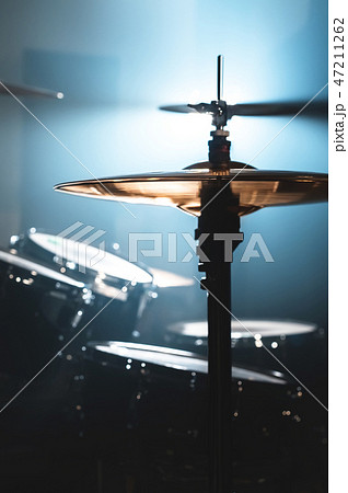 Close-up Drum set in a dark room against the backdrop of the spotlight. Atmospheric background Close-up Drum set in a dark room against the backdrop of the spotlight. Atmospheric background 47211262