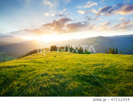 Sunset in the mountain valley. 47212334