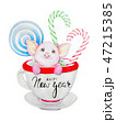Piglet with Christmas candy sits in a cup.  47215385