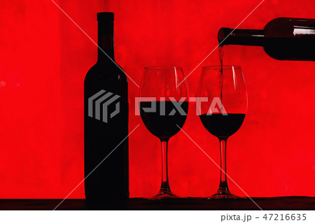 bottle of wine and glass with red wine 47216635
