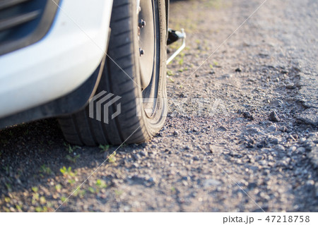 flat tire with damaged disc after got into a pit 47218758