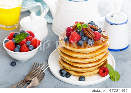 Stack of fluffy pancakes with fresh berries 47224492