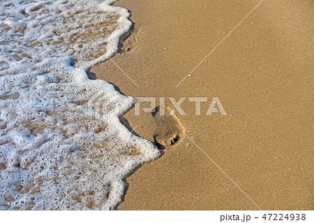 beach, wave and footprints at sunset time beach, wave and footprints at sunset time 47224938