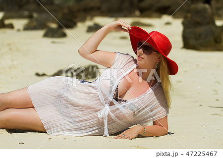 Young blonde beautiful woman at the beach in bikini Young blonde beautiful woman at the beach in bikini 47225467