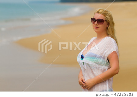 Young blonde beautiful woman at the beach in bikini Young blonde beautiful woman at the beach in bikini 47225503