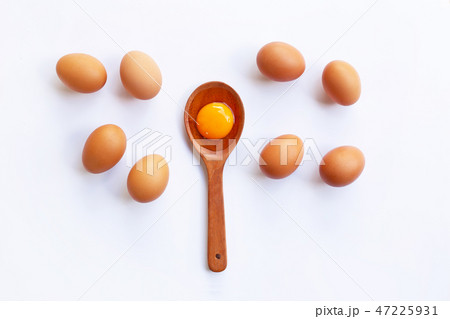 Chicken eggs with yolk on white background. Chicken eggs with yolk on white background. 47225931
