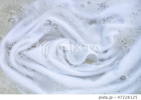 Washing clothes, white clothes soaked. Washing clothes, white clothes soaked. 47226125