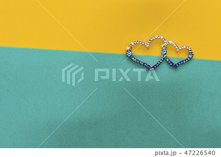Two hearts on a yellow turquoise background. Two hearts on a yellow turquoise background. 47226540