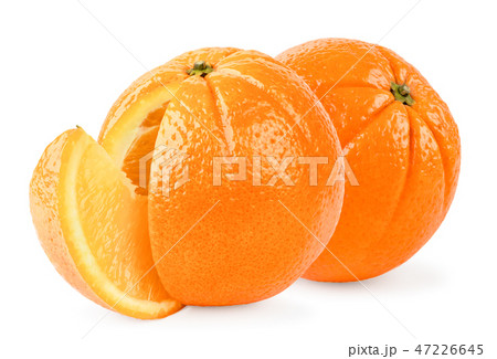 Two ripe oranges and a slice close-up on a white Two ripe oranges and a slice close-up on a white 47226645
