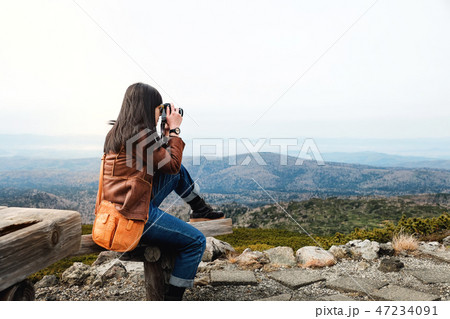 Travel Concept. Young Traveling Woman with Camera 47234091