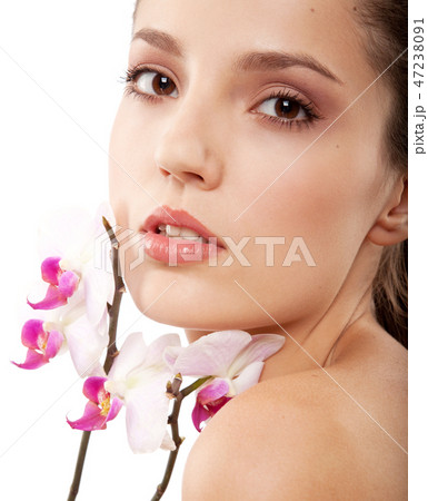 woman and orchid 47238091