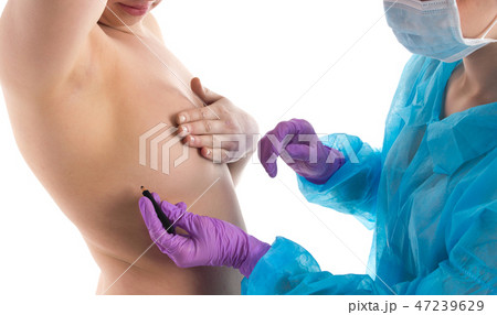 The doctor is drawing under chest The doctor is drawing under chest 47239629