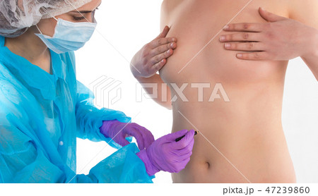 The doctor is drawing on a body 47239860