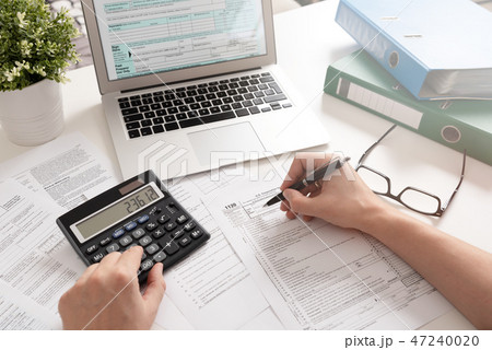 Accountant working with US tax forms 47240020