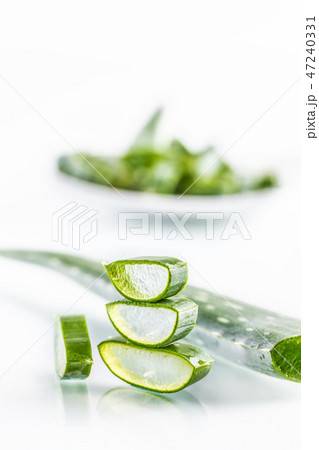 Slices of aloe vera with gel on white background 47240331