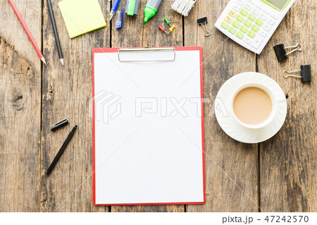 Office table with blank paper on old wooden table Office table with blank paper on old wooden table 47242570