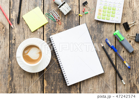 Office table with blank paper on old wooden table Office table with blank paper on old wooden table 47242574