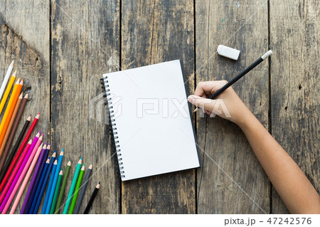 Girl hand drawing, blank paper and colorful pencil Girl hand drawing, blank paper and colorful pencil 47242576