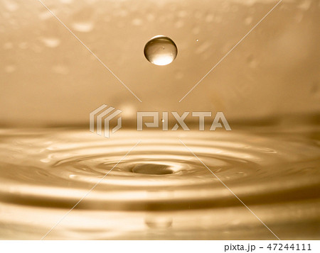 orange water splash isolated 47244111