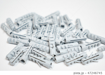 Plastic dowel pin or wall plugs on white background Plastic dowel pin or wall plugs on white background 47246745