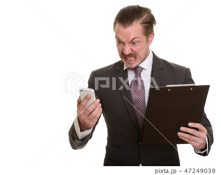 Portrait Of Man Isolated Against White Background Portrait Of Man Isolated Against White Background 47249039