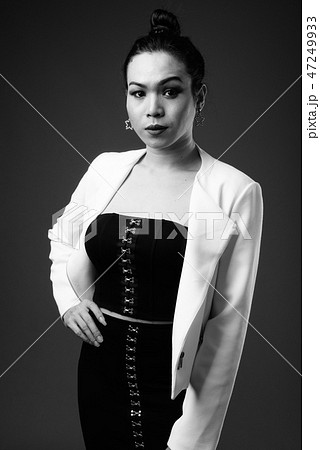 Young beautiful Asian transgender businesswoman in black and whi Young beautiful Asian transgender businesswoman in black and whi 47249933